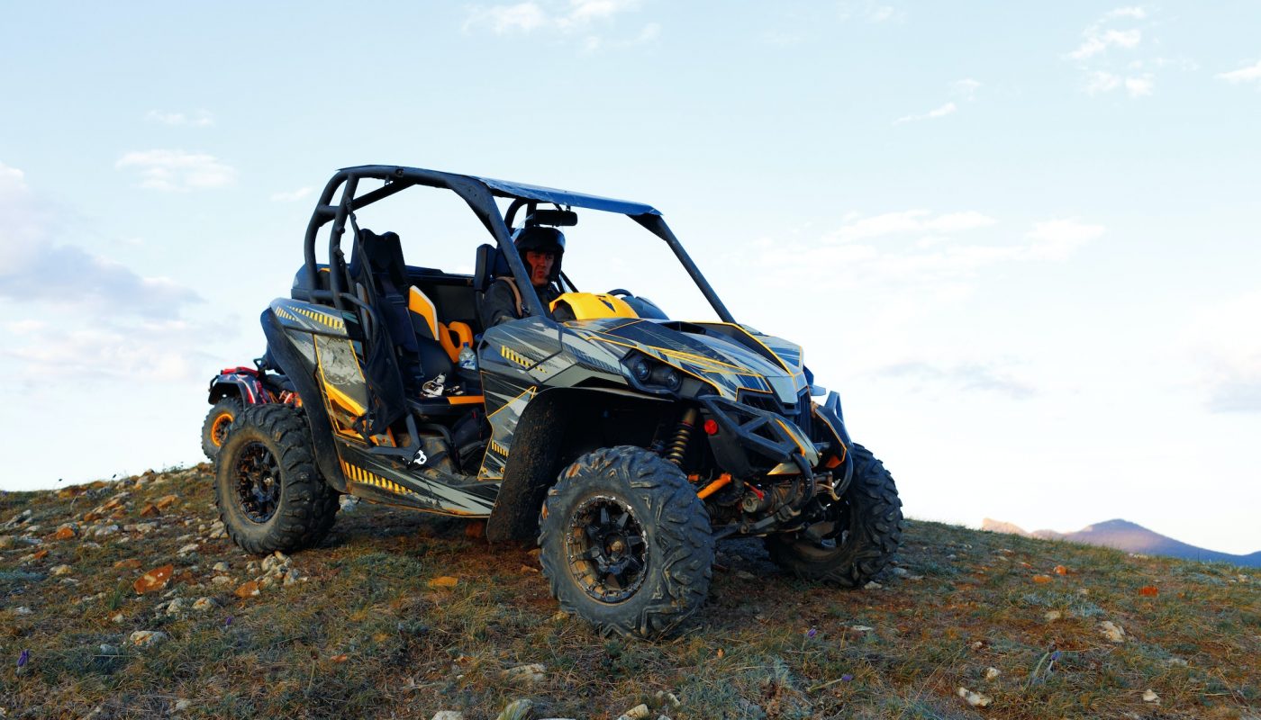 man-in-helmet-sitting-on-atv-quad-bike-in-mountains-pu68hzlpbl17xn1w86w7buy72firkjbsymq41o5jcw